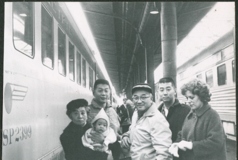 Sakura family at train station (ddr-densho-523-414)