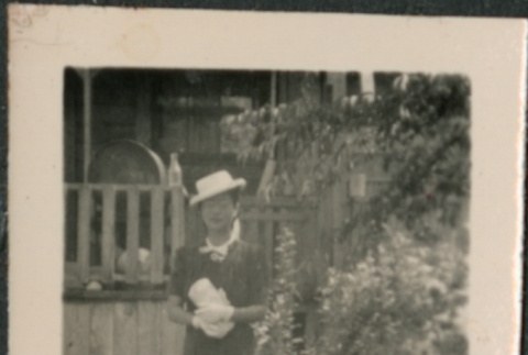 Woman standing in garden (ddr-densho-523-101)