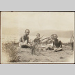 Children sitting on the beach (ddr-densho-278-74)