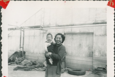 Woman holding a baby (ddr-densho-321-1097)