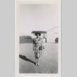 Woman standing in camp administration area (ddr-manz-7-34)