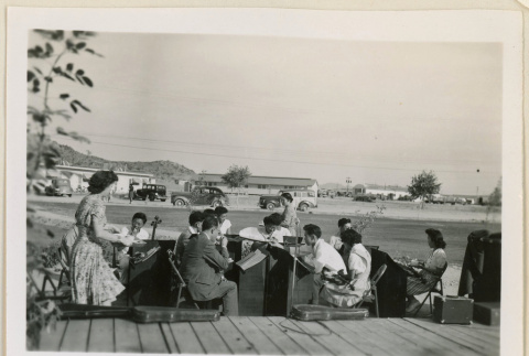 Orchestra enjoying refreshments (ddr-densho-37-989)