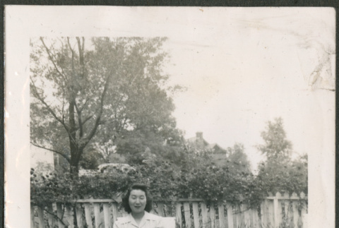 Woman sitting in chair in garden (ddr-densho-316-401)