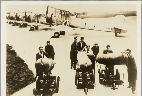 Airfield workers carting bombs (ddr-njpa-13-211)
