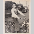 Photo of a boy on a bicycle (ddr-densho-483-420)
