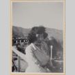 Woman on windy bridge (ddr-densho-522-15)