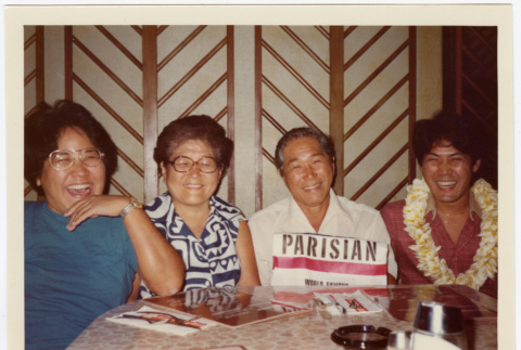 Two men and two women seated at a table (ddr-densho-426-579)