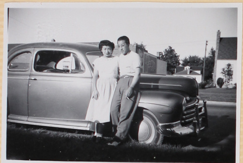Couple standing next to car (ddr-densho-522-70)