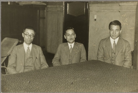Three men sitting at a table (ddr-njpa-13-1267)