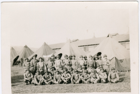 Group of soldiers outside field with tents (ddr-densho-329-1367)