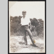 Man stands in a clearing (ddr-densho-404-4)
