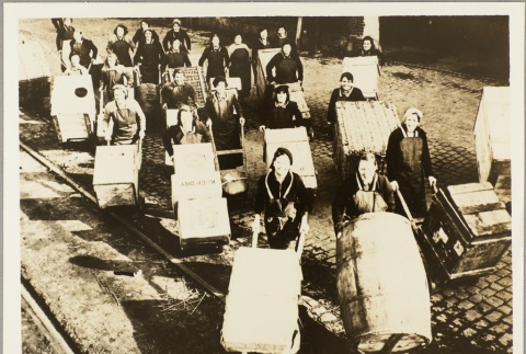 Female factory workers carting supply boxes (ddr-njpa-13-244)
