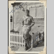Man standing next to low fence (ddr-densho-466-853)