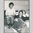 Couple unwrapping gifts (ddr-densho-523-526)