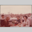 Chester, Agnes and Tina Sakura with baby at a picnic (ddr-densho-523-413)