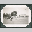 Two men playing baseball in field (ddr-densho-475-694)