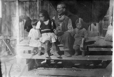 [Mr. Taniguchi with children] (ddr-csujad-56-277)