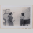 Betty and Mary Alice handing curtain (ddr-densho-462-265)