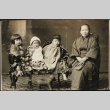 Grandmother and grandchildren on a settee (ddr-densho-259-47)