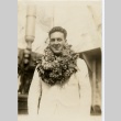 A man wearing leis (ddr-njpa-1-1001)