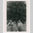 Walter Tanaka's father and brother with puppy (ddr-densho-1007-32)