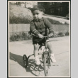 Child riding a tricycle (ddr-densho-483-1117)