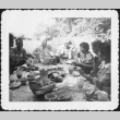 Group eating around a table outside (ddr-densho-434-410)