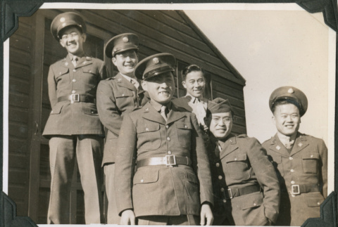 Six men in uniform on steps outside camp building.  Joe Iwataki in back without jacket (ddr-ajah-2-478)