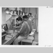 Men at work in the radio repair shop (ddr-fom-1-841)