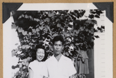 Man and woman standing outside a home (ddr-densho-542-333)