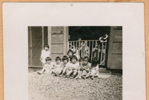 Group of children in barracks doorway (ddr-densho-493-48)