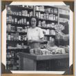 Woman poses with a product (ddr-densho-542-117)