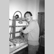 Man with film reels (ddr-densho-1007-556)