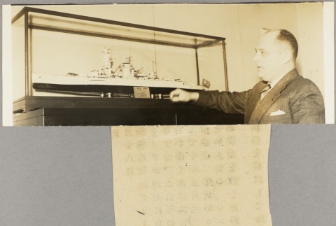 Photograph of a man with a model ship (ddr-njpa-13-965)