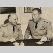 Arthur D. Struble posing at a desk with another military leader (ddr-njpa-1-1812)