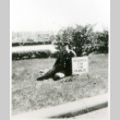 Officer sitting on lawn (ddr-densho-1007-607)