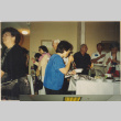 Crowd around a buffet table (ddr-densho-466-504)