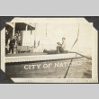 Man sitting on deck of ship. City of Natchez (ddr-densho-326-517)