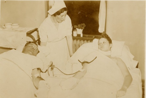 Babe Ruth giving a blood transfusion to his daughter Julia (ddr-njpa-1-1392)