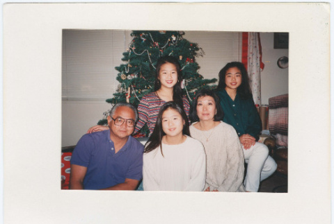 Christmas card with 5 people in front of a Christmas tree (ddr-densho-430-270)