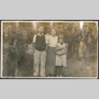 Woman with boy and girl standing in yard (ddr-densho-316-196)