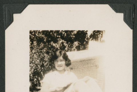 woman in wicker chair (ddr-densho-378-474)
