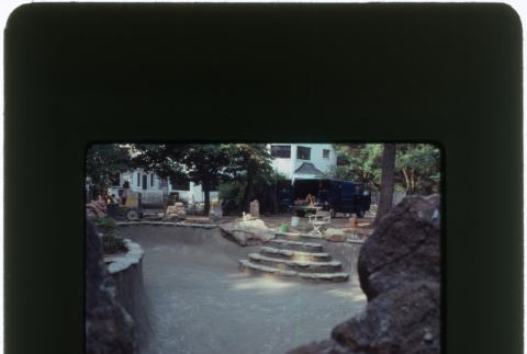 Construction on a pool and rock garden (ddr-densho-377-1144)