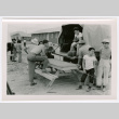 Crowd around picnic table and truck (ddr-densho-475-23)