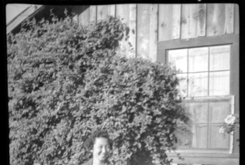 Woman in front of ivy-covered building (ddr-densho-475-145)