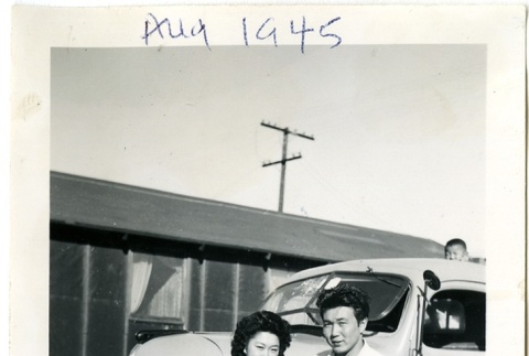 Man and woman standing in front of a truck (ddr-manz-6-69)
