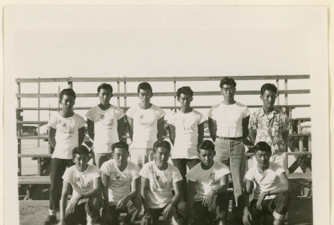 Basketball team seated on bleachers (ddr-densho-37-1025)