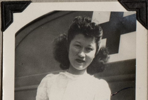 Woman standing by medical vehicle (ddr-densho-587-57)