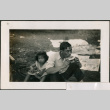 Man and girl eating watermelon (ddr-densho-316-402)