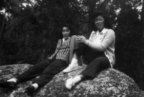 Betty Wake and Lilyan Nagata sitting on a rock (ddr-densho-336-8)